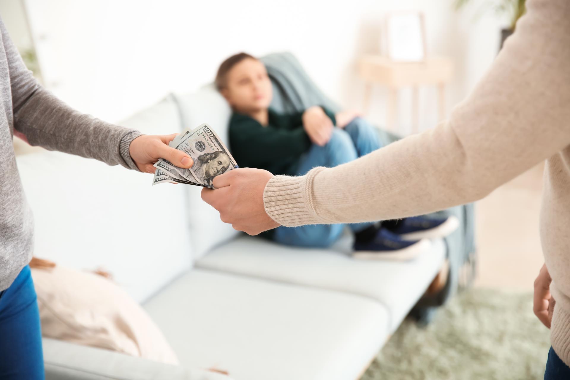 Parents Holding Money