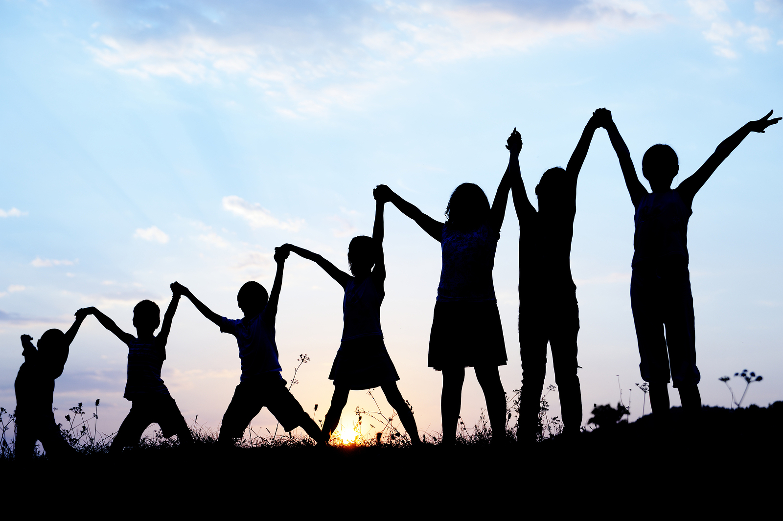 Children Holding and Raising Hands